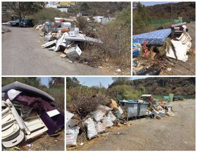 Basura y enseres acumulados junto a unos contenedores en Tecén/TA.